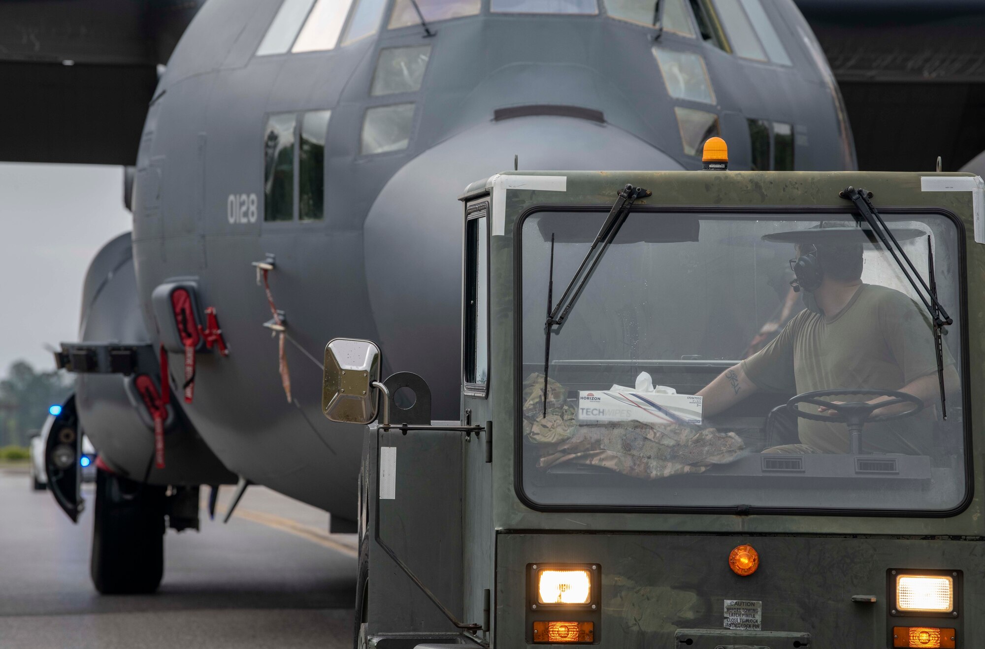 An Air Commando with the 1st Special Operations Aircraft Maintenance Squadron tows an AC-130U “Spooky” gunship to the airpark at Hurlburt Field, Florida, April 17, 2021.