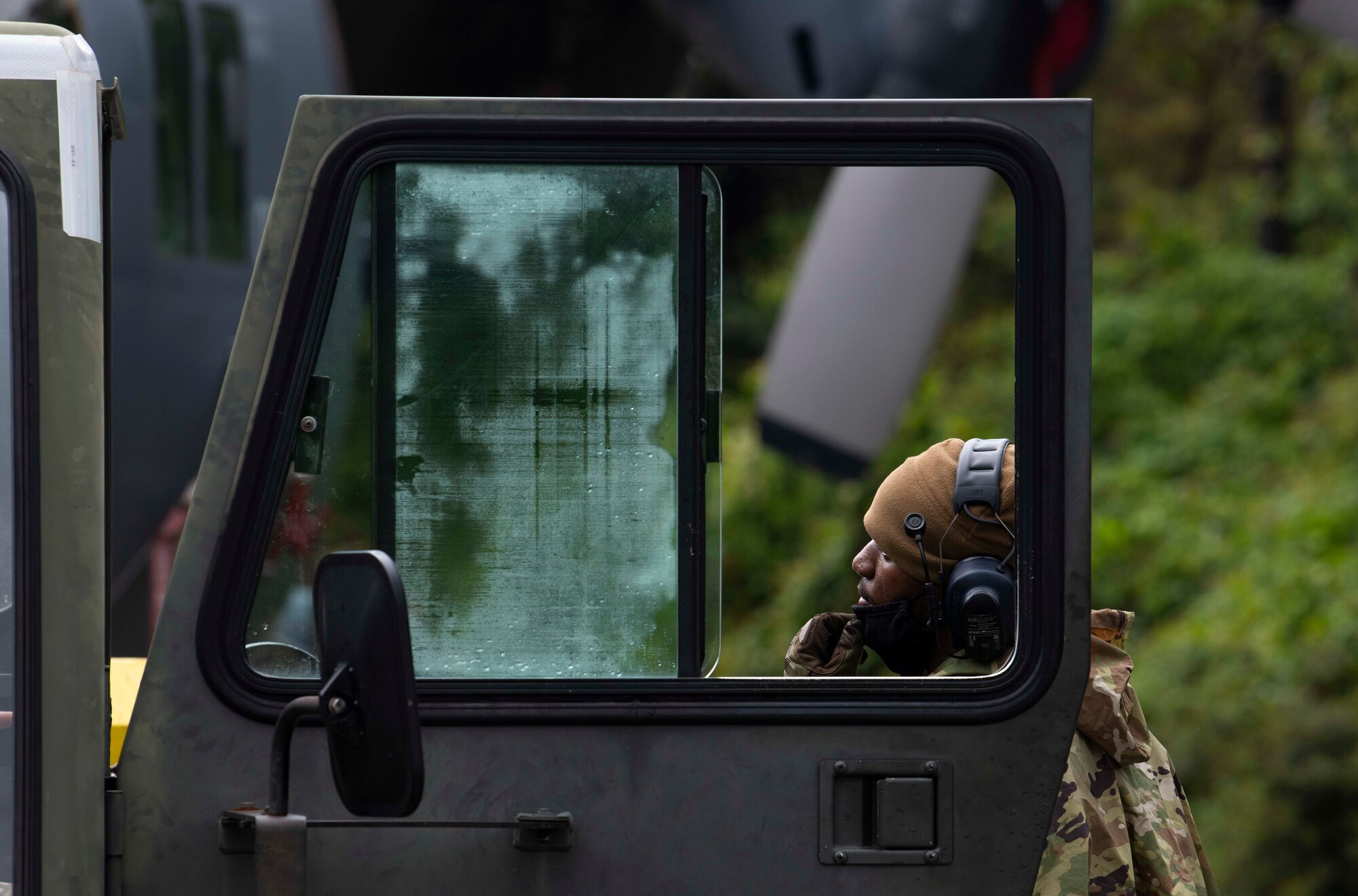 U.S. Air Force Staff Sgt. Kendall Washington, a crew chief with the 1st Special Operations Aircraft Maintenance Squadron, discusses the best approach to maneuver an AC-130U “Spooky” gunship to the airpark at Hurlburt Field, Florida, April 17, 2021.