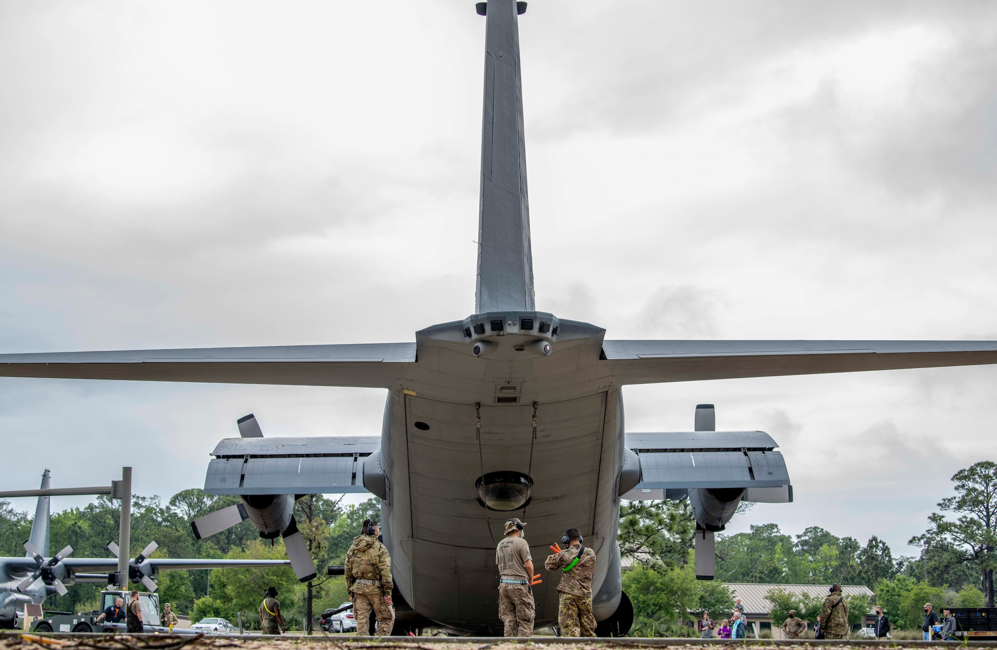 Air Commandos with the 1st Special Operations Aircraft Maintenance Squadron push an AC-130U “Spooky” gunship to its spot in the airpark at Hurlburt Field, Florida, April 17, 2021.