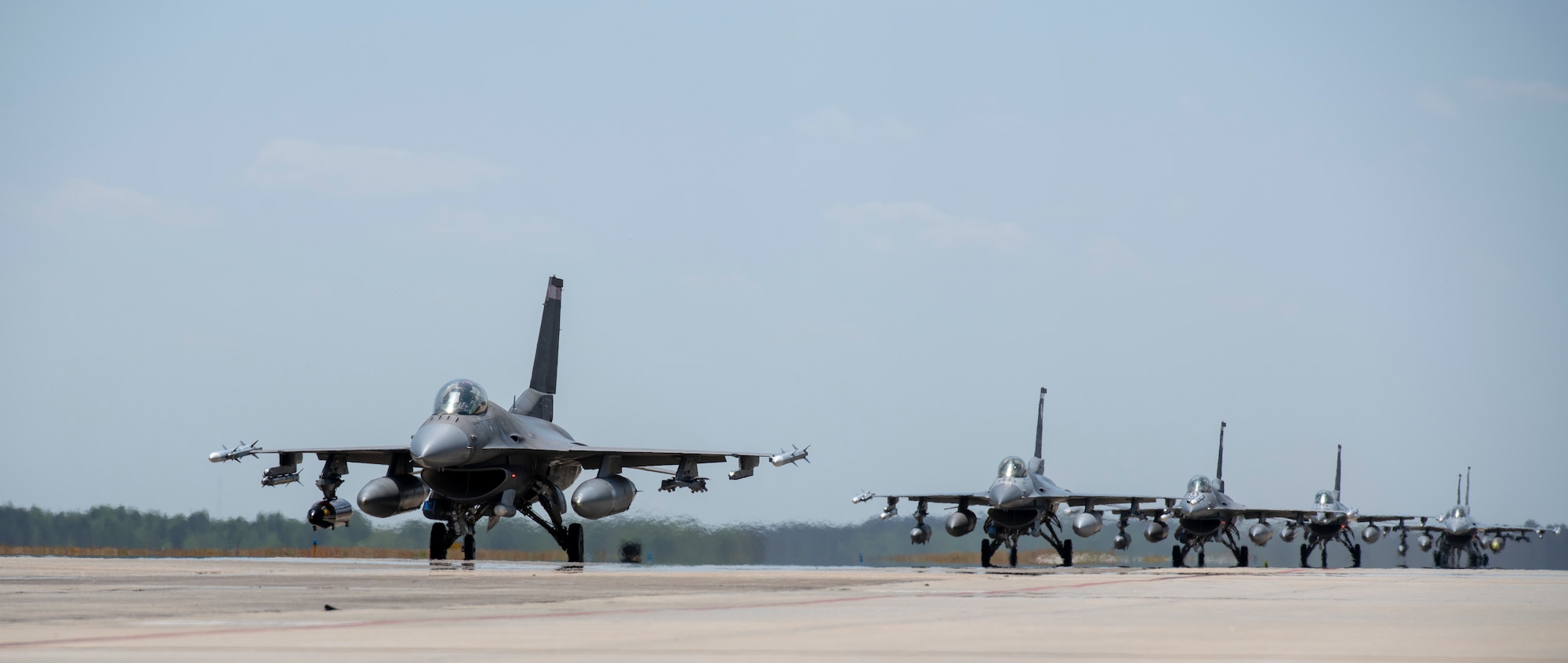 A photo of jets on a flightline.