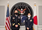 Japanese and American military officers pose for group photo