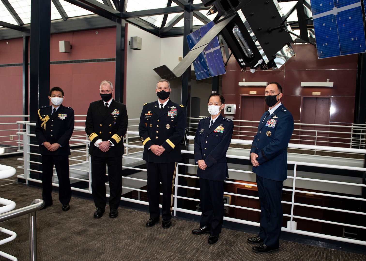 Japanese and American military officers pose for group photo