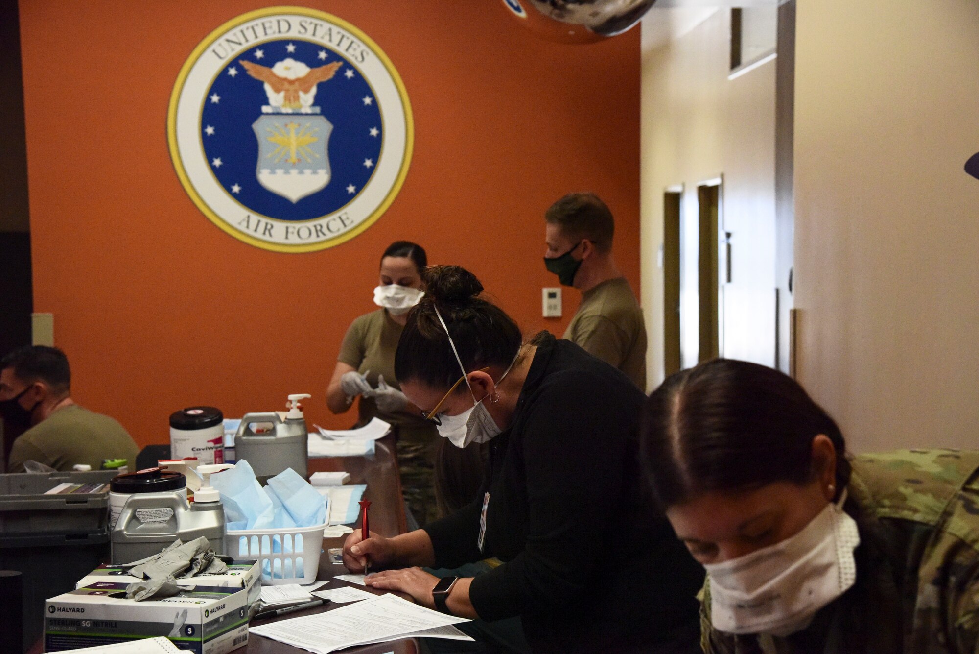 A photo of medical workers preparing vaccines