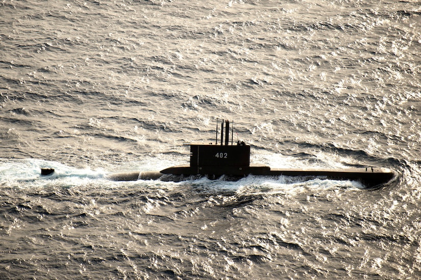 A submarine moves through the water.