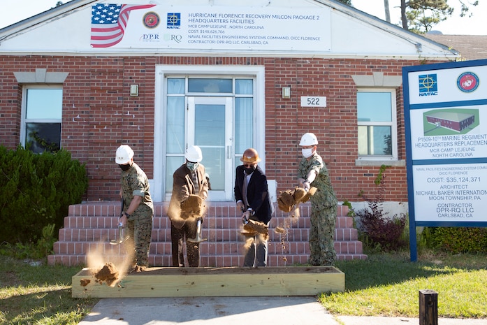 From left: U.S. Marine Corps Maj. Gen. Julian D. Alford, commanding general, Marine Corps Installations East-Marine Corps Base Camp Lejeune, Walter E. Gaskin, Secretary of the North Carolina Department of Military and Veterans Affairs, George Rogers, chief executive officer, RQ Construction, LLC,  and U.S. Navy Rear Adm. Dean VanderLey, commander, Naval Facilities Engineering Systems Command Atlantic, shovel the ceremonial soil during a ground-breaking ceremony for the hurricane recovery military construction projects at Marine Corps Base Camp Lejeune, North Carolina, April 22, 2021.  The ground-breaking ceremony marked the first of seven military construction project packages to replace facilities on MCB Camp Lejeune, Marine Corps Air Station New River and MCAS Cherry Point damaged by Hurricane Florence in September 2018. (U.S. Marine Corps photo by CWO2 Brian Lautenslager)