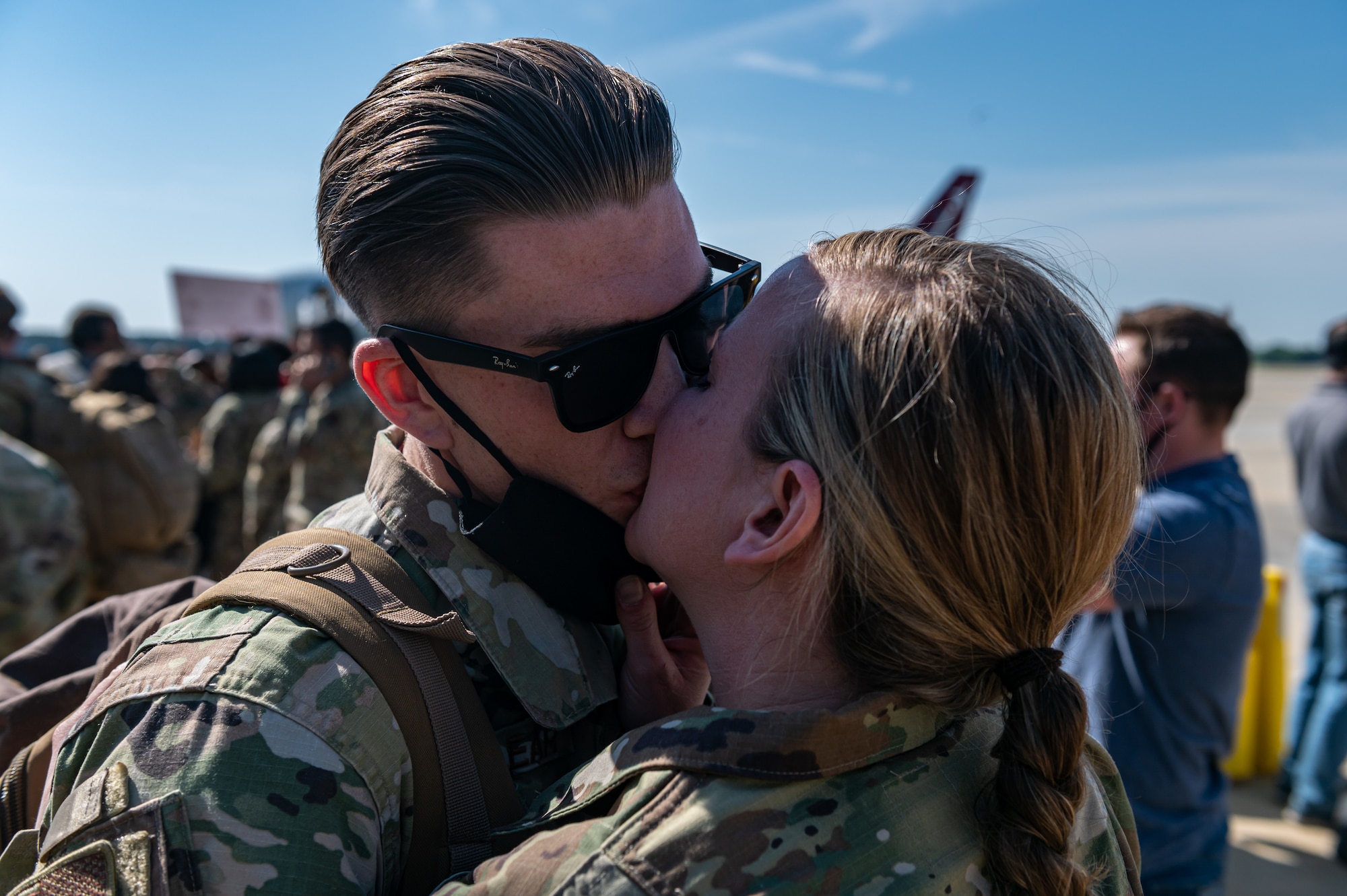 A photo of two Airmen embracing.