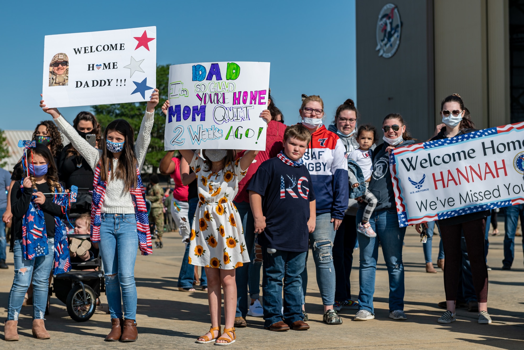 A photo of people holding signs.