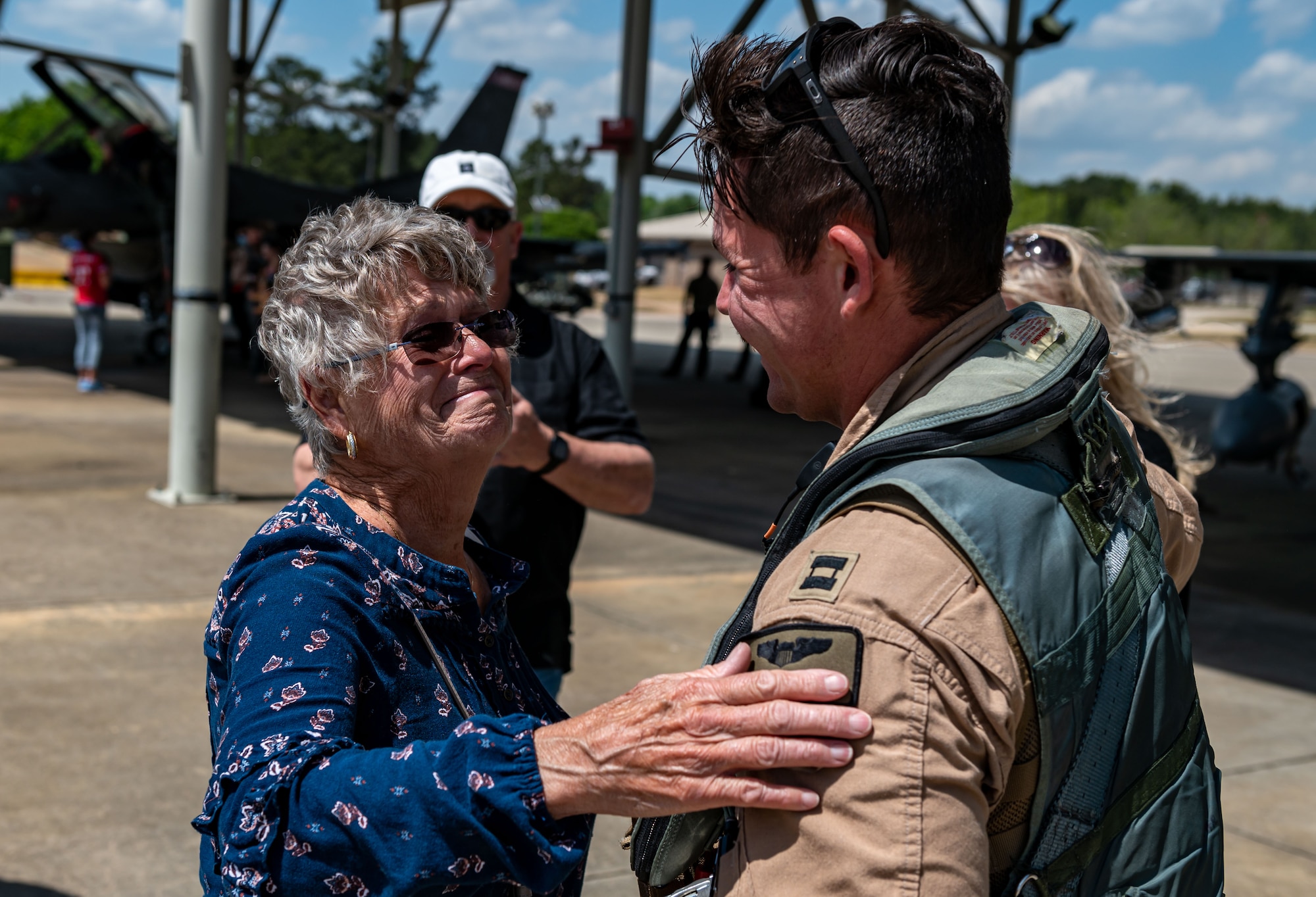 A photo of a pilot embracing a family member.