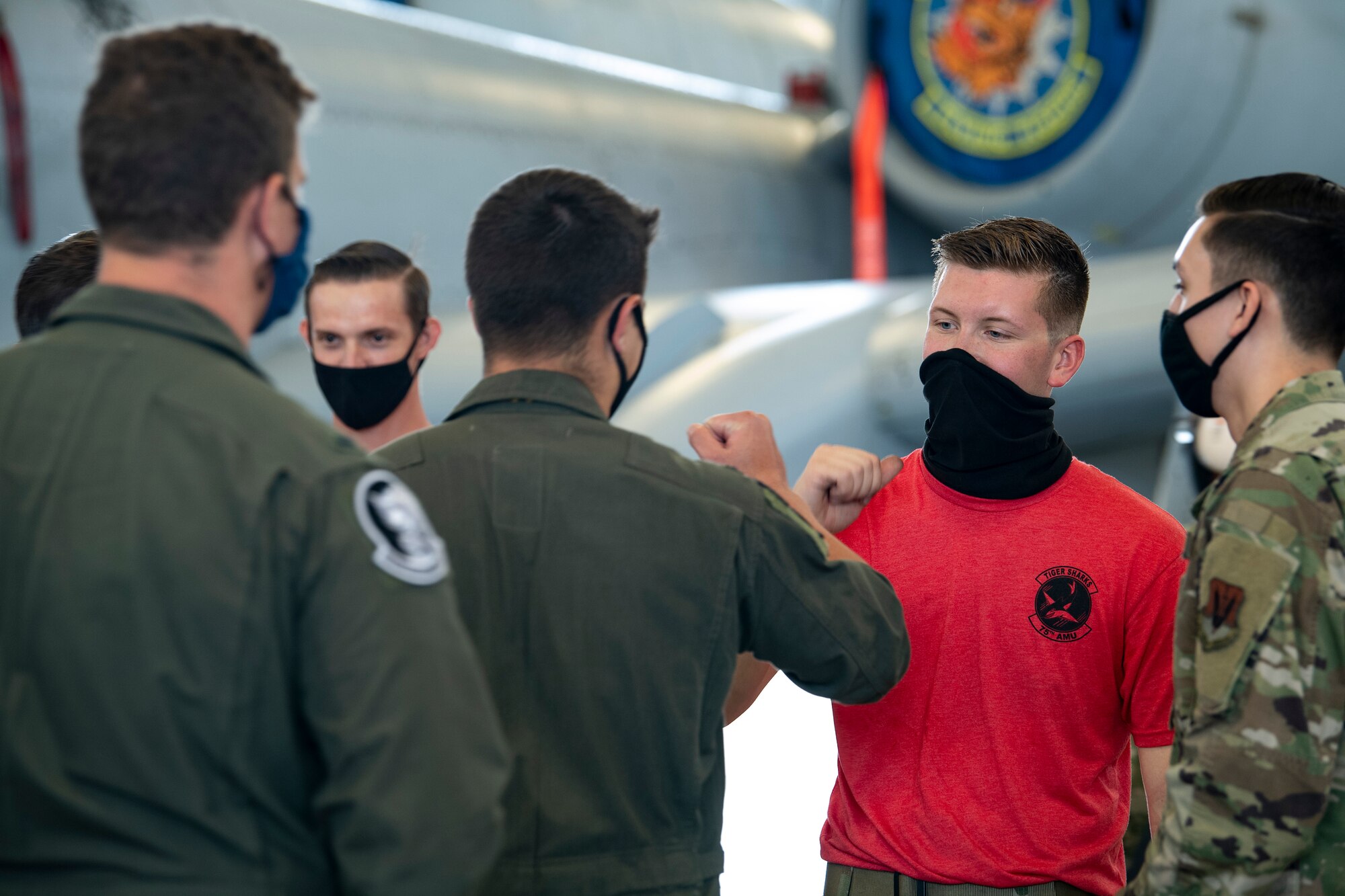 A photo of Airmen bumping fists after a competition