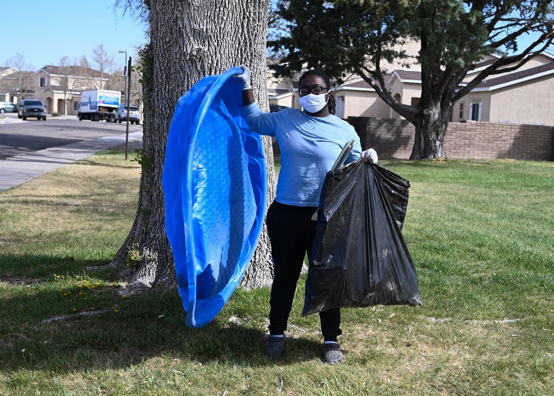 An Airman poses on Earth Day.