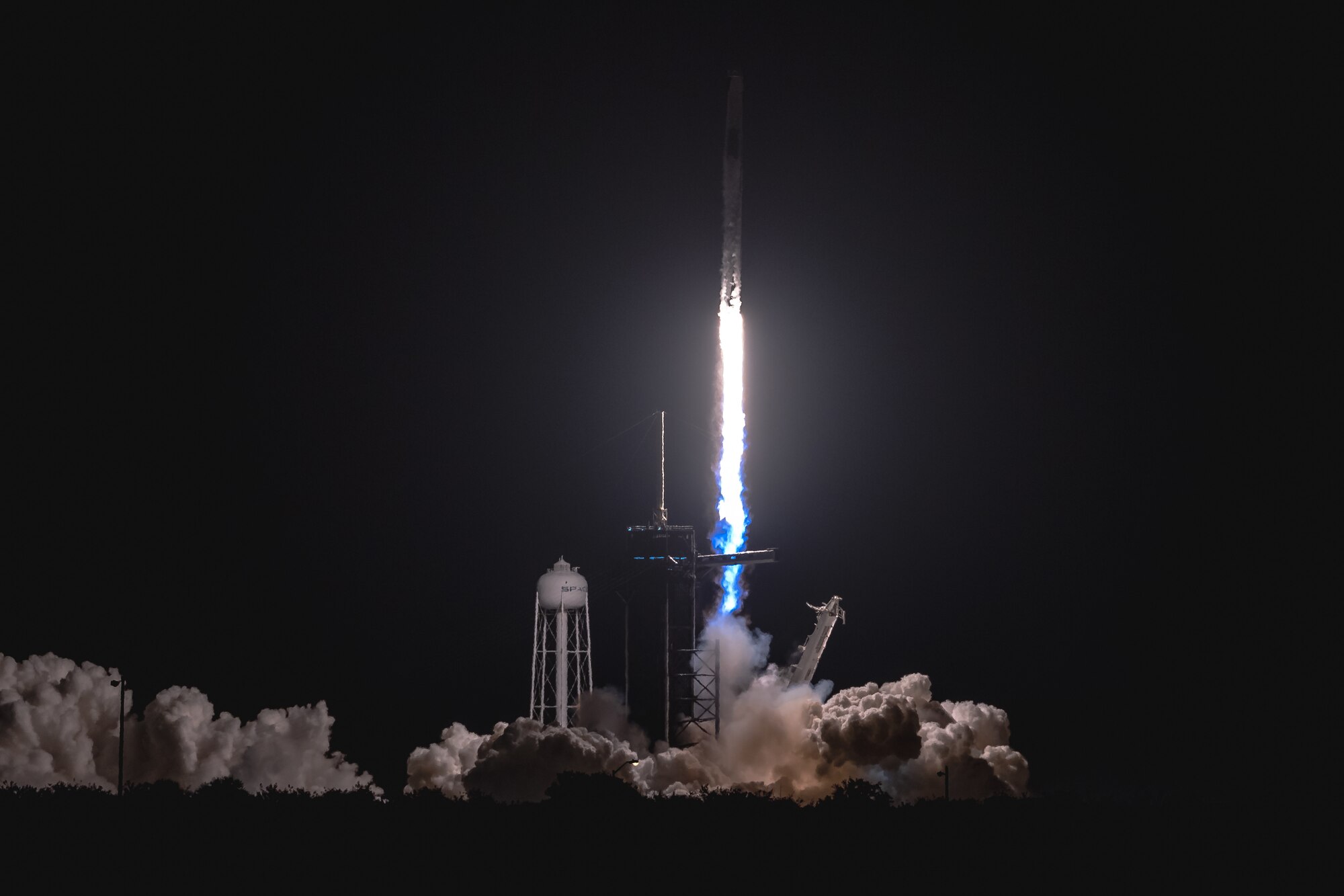 A SpaceX Falcon 9 rocket launches from Space Launch Complex 39A April 23, 2021, at Kennedy Space Center, Florida. The rocket launched the four members of Dragon Crew-2 into space. The astronauts will spend six months on the International Space Station performing a variety of experiments and maintenance actions. (U.S. Space Force photo by Joshua Conti)