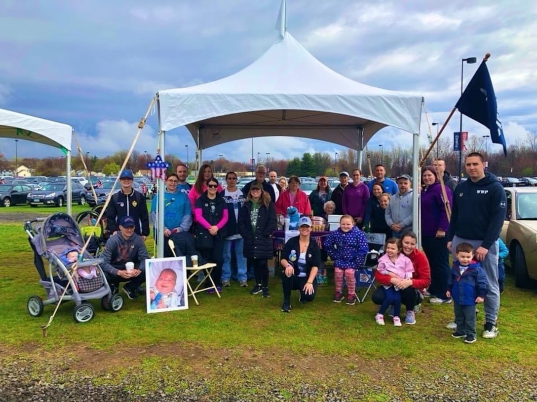 U.S. Air Force Master Sgt. Jessica Roy (front center), 103rd Security Forces Squadron S2 intelligence and investigations superintendent and antiterrorism program manager, and members of “Team Austin Roy,” including members of the Roy family and Airmen from the 103rd Airlift Wing, at the Greater Hartford March for Babies at Pratt and Whitney Stadium at Rentschler Field in East Hartford, Connecticut, April 29, 2018. Roy has dedicated the years following her infant son’s passing in 2012 to advocacy work with the March of Dimes organization. (Courtesy photo)