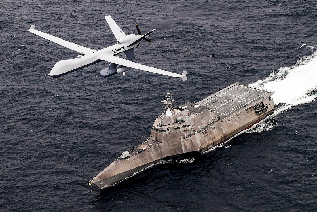 An MQ-9 Sea Guardian unmanned maritime surveillance aircraft system flies over the littoral combat ship USS Coronado in the Pacific Ocean, April 21, 2021 during U.S. Pacific Fleet’s Unmanned Systems Integrated Battle Problem 21. The exercise integrates manned and unmanned capabilities into challenging operational scenarios to generate warfighting advantages.