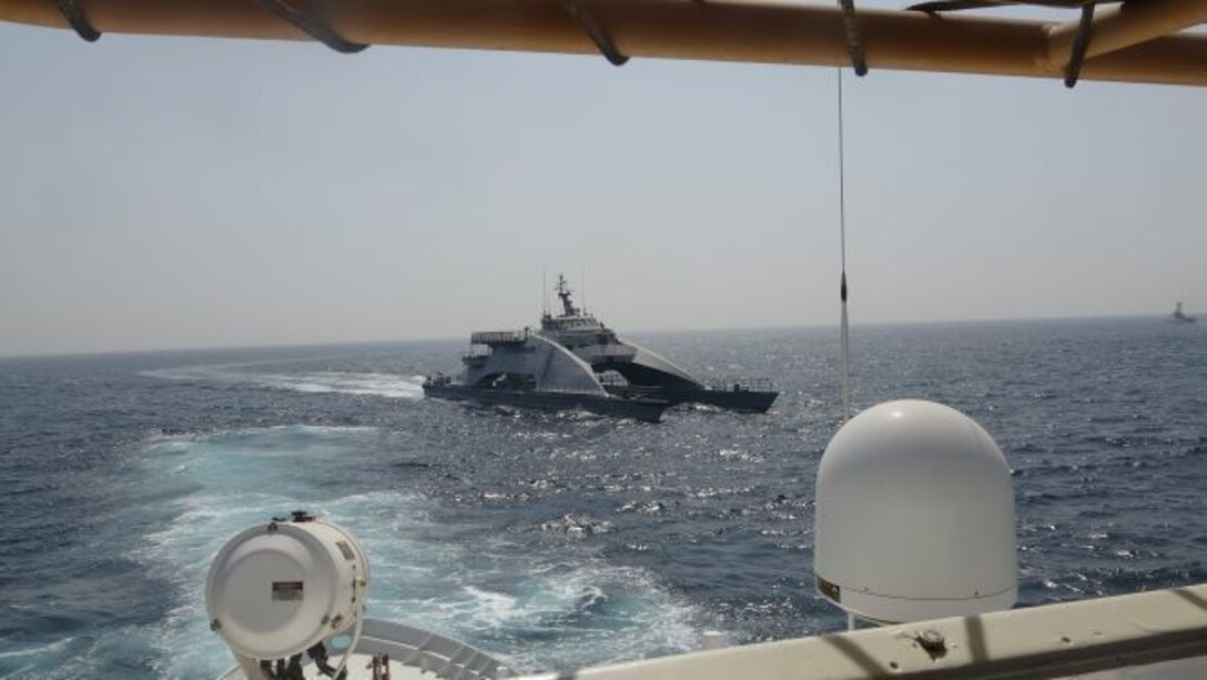 210402-N-NO146-1002 ARABIAN GULF (April 2, 2021) Iran’s Islamic Revolutionary Guard Corps Navy (IRGCN) Harth 55, center, approaches the Coast Guard patrol boat USCGC Wrangell (WPB 1332) bow in an unsafe and unprofessional action forcing the Wrangell to conduct a defensive maneuver, Apr. 2. The U.S. vessel was conducting a routine maritime security patrol in international waters of the southern Arabian Gulf at the time of the incident. The USCGC ships are assigned to Patrol Forces Southwest Asia (PATFORSWA), the largest U.S. Coast Guard unit outside the United States, and operate under U.S. Naval Forces Central Command’s Task Force 55. (U.S. Navy photo)