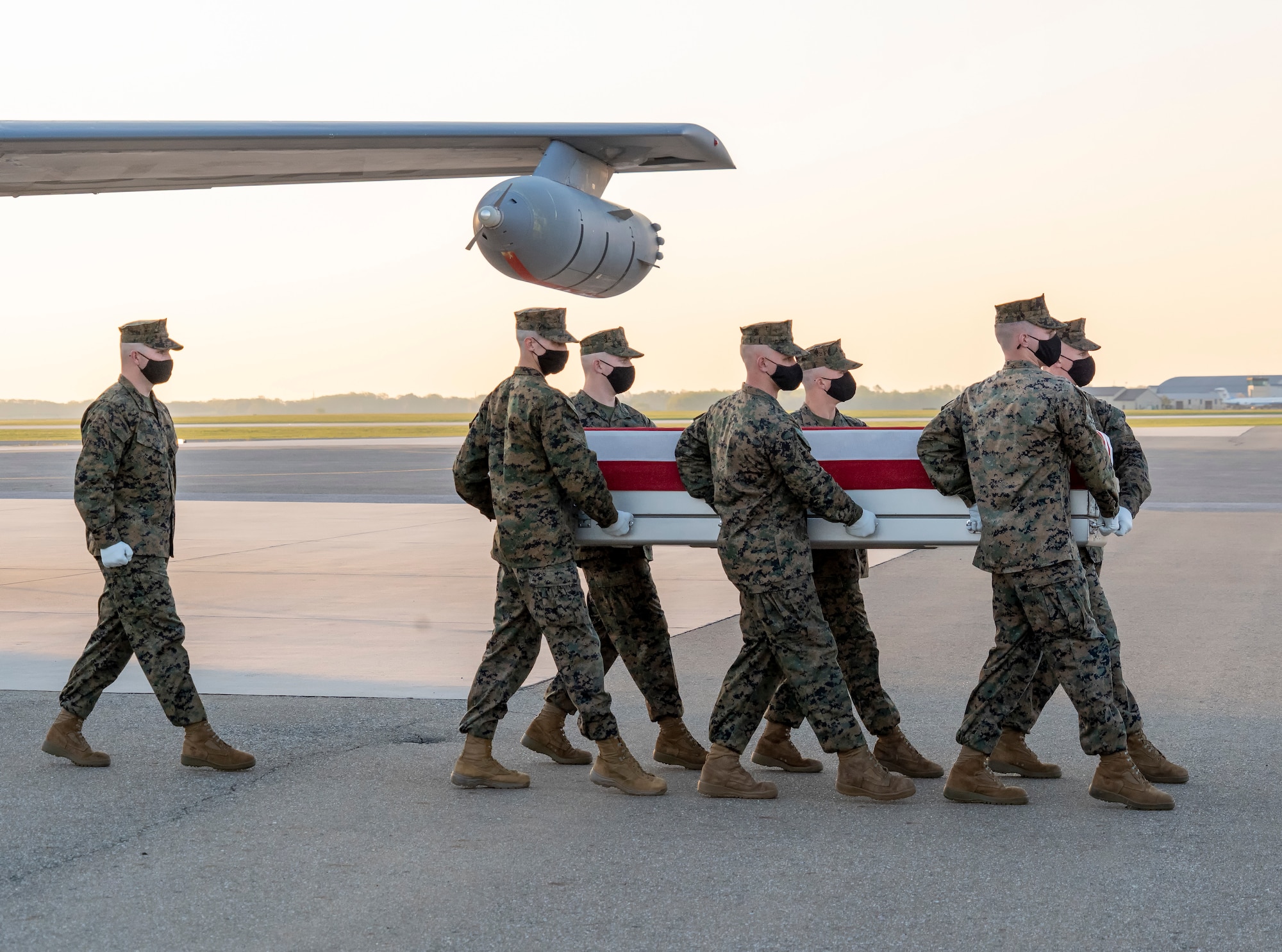 A U.S. Marine Corps carry team transfers the remains of Marine Sgt. Amanda N. Brazeal of Chunchula, Alabama, April 24, 2021 at Dover Air Force Base, Delaware. Brazeal was assigned to Marine Corps Embassy Security Group Region 2, Marine Corps Embassy Security Group Headquarters, Quantico, Virginia. (U.S. Air Force photo by Jason Minto)