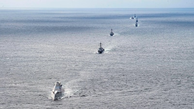 Zumwalt-class guided-missile destroyer USS Michael Monsoor (DDG 1001), front, participates in an Unmanned Integrated Battle Problem training exercise. Commander, U.S. Third Fleet is currently executing U.S. Pacific Fleet’s Unmanned Integrated Battle Problem 21.