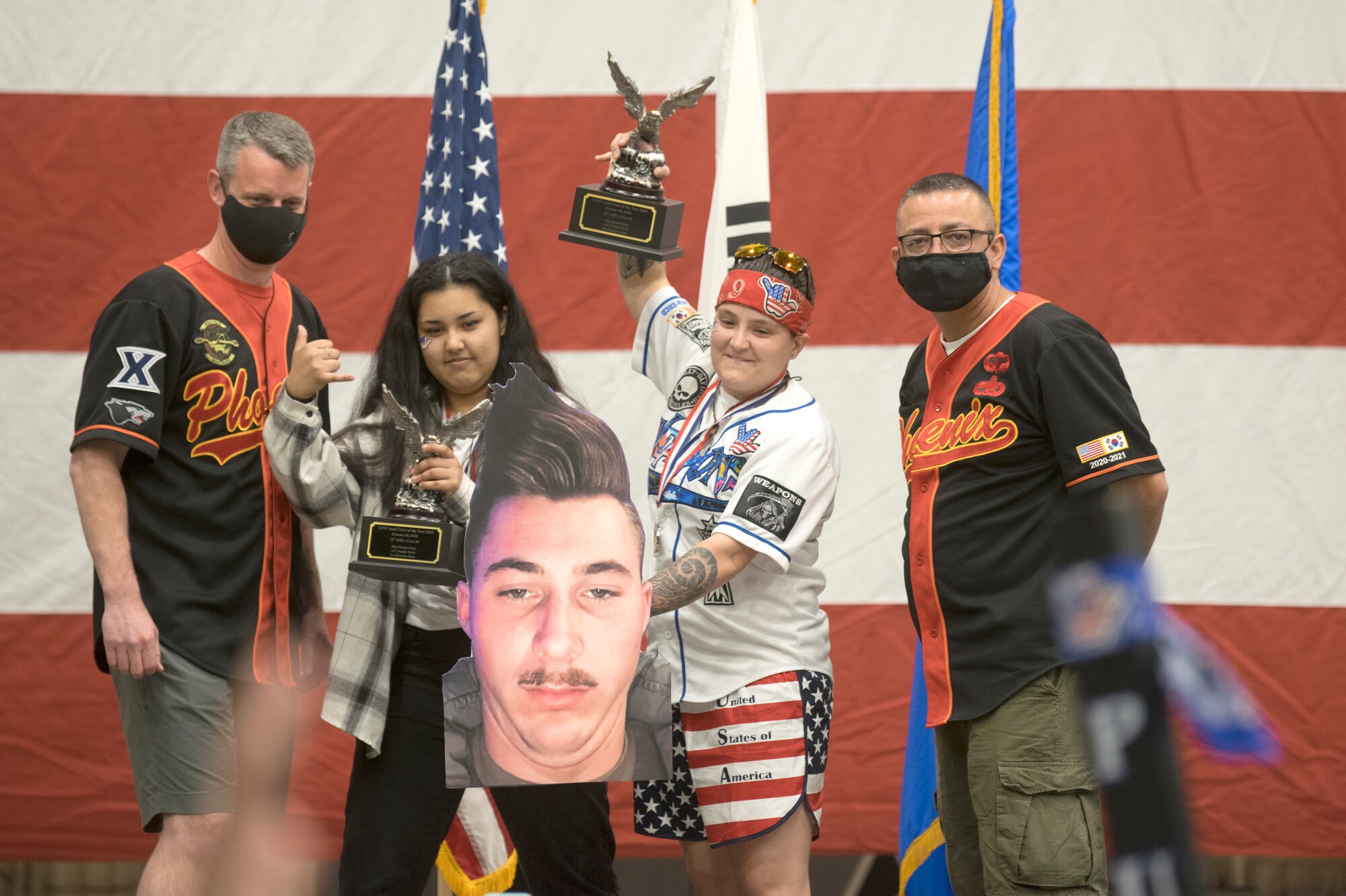 Staff Sgt. Yesenia Perez and A1C Natalie Navia along with a poster of Senior Airman Brandon Shaw wins the 2020 8th Maintenance Group Load Crew of the Year award at Kunsan Air Base, Republic of Korea March 24, 2021. This was part of Kunsan’s 2020 Maintenance Professional of the Year awards. (U.S. Air Force photo by Tech. Sgt. Will Bracy)