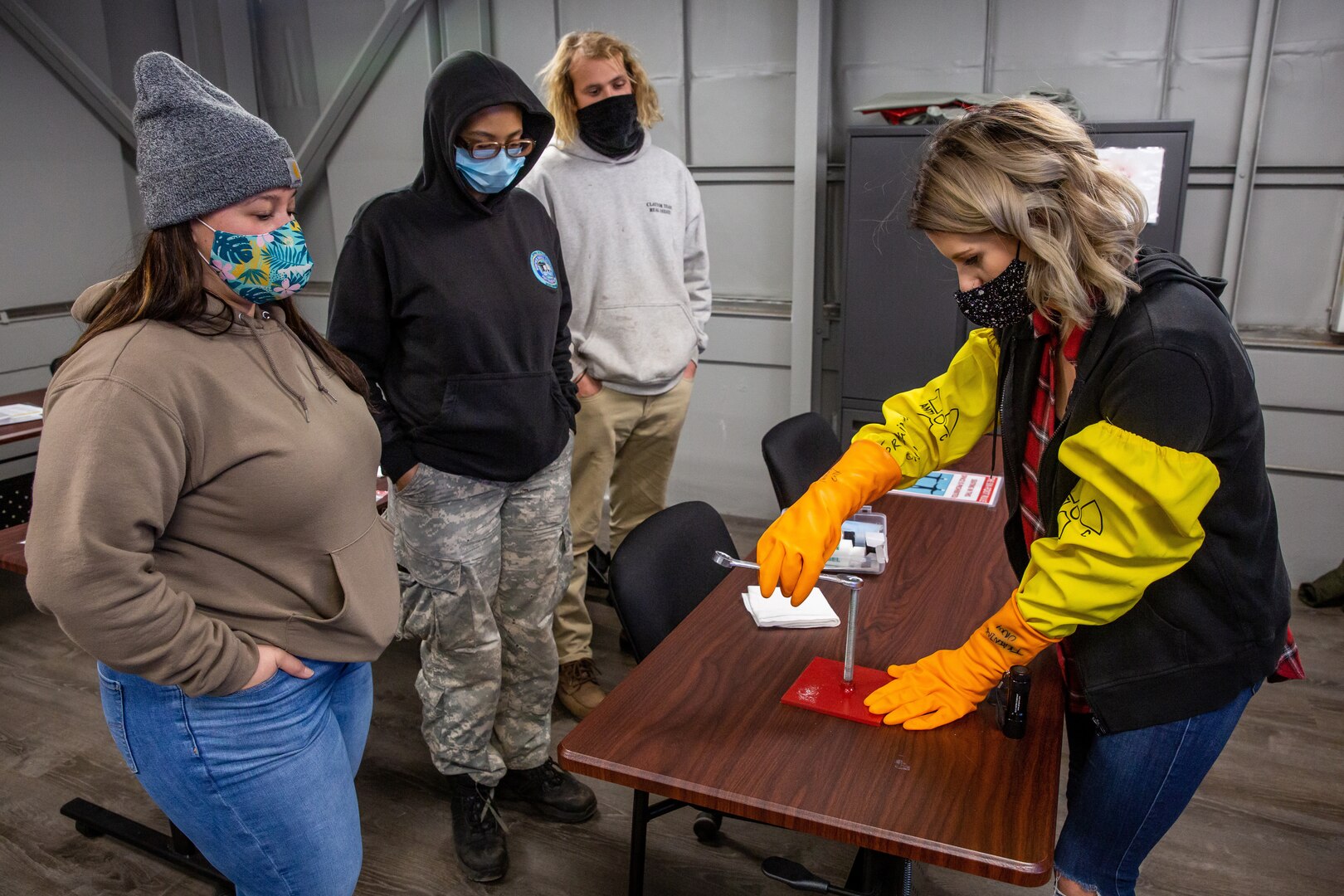 Invented by Dean Luxton in 1968, Glo Germ is a product that is typically used in the medical and food industry fields to show the dangers of cross contamination—and is now an educational tool that Norfolk Naval Shipyard (NNSY) has repurposed to deliver superior radiological contamination training due to the product’s visual properties under a black light.