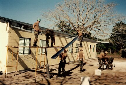 Soldiers from the Louisiana National Guard’s 225th Engineer Group help build three schools in Biscayne, Crooked Tree and Orange Walk in Belize in 1996 as part of the State Partnership Program between Belize and Louisiana. The two have been partners under the program for 25 years.