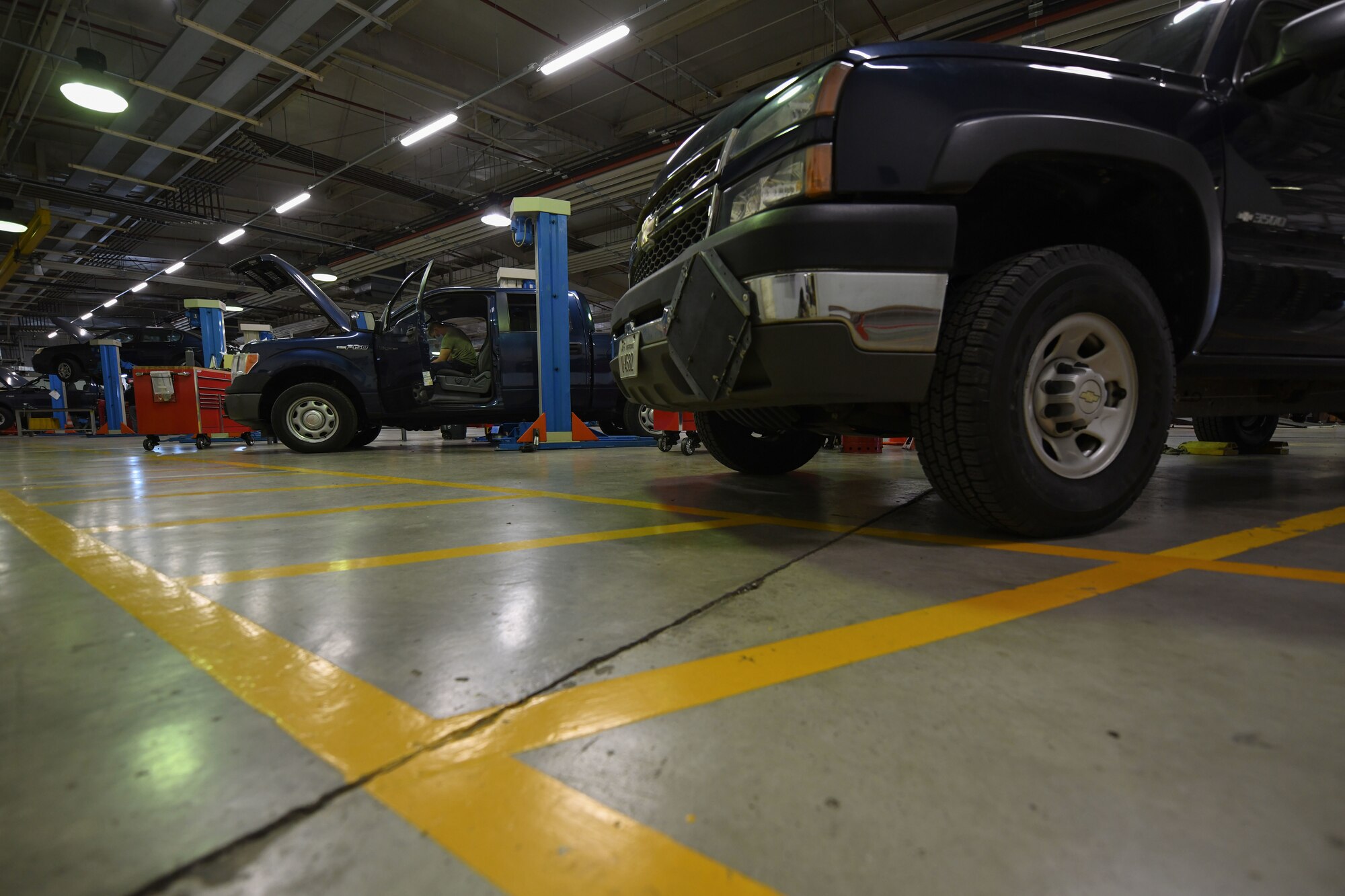 Airman 1st Class Korey Sarantopoulos, 31st Logistics Readiness Squadron vehicle maintenance technician, repairs a government vehicle at Aviano Air Base, Italy, April 20, 2021. Sarantopoulos repaired the heat, ventilation, and air conditioning (HVAC) system of a Ford F-150 truck. The HVAC system took approximately eight hours to repair. (U.S. Air Force photo by Senior Airman Ericka A. Woolever)