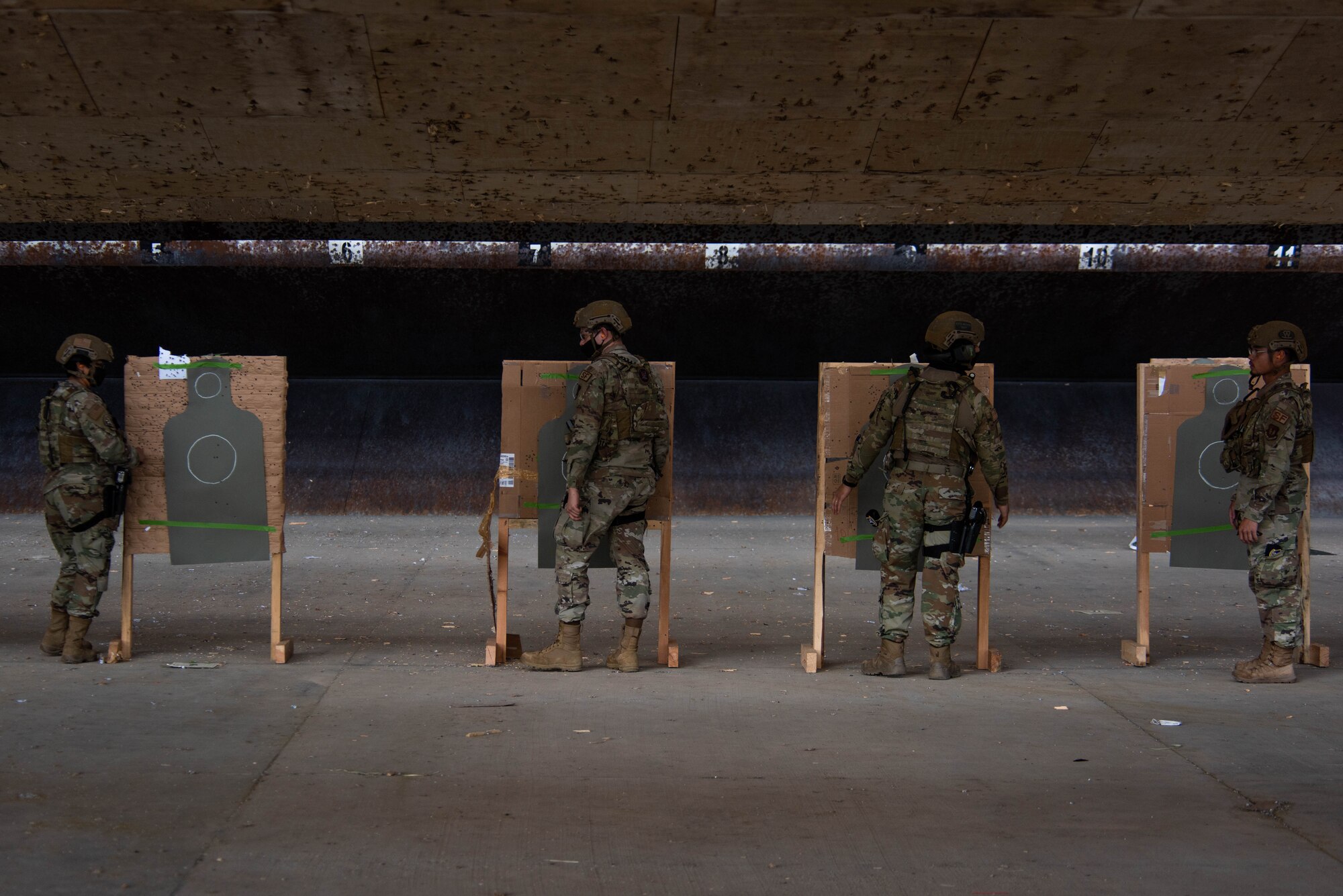 Airmen assigned to the 39th Security Forces Squadron check targets during annual combat arms training at Incirlik Air Base, Turkey, April 21, 2021.  The 39th SFS provides force protection for Incirlik, its geographically separated units in Turkey, law enforcement services and support for several contingency operations for United States Air Forces in Europe – Air Forces Africa. (U.S. Air Force photo by Senior Airman Derek Seifert)