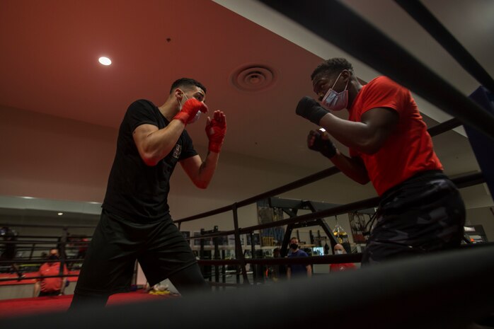 U.S. Marine Corps boxers with the II Marine Expeditionary Force Martial Arts Center of Excellence boxing program practice fighting techniques on Marine Corps Base Camp Lejeune, N.C., April 20, 2021. The boxing program prepares II MEF Marines to compete in professional level matches through rigorous physical exercise and mental training. As a pilot program, it has already showcased four of its boxers in 2021 at the U.S.A. National Boxing Championship as well as more upcoming matches.