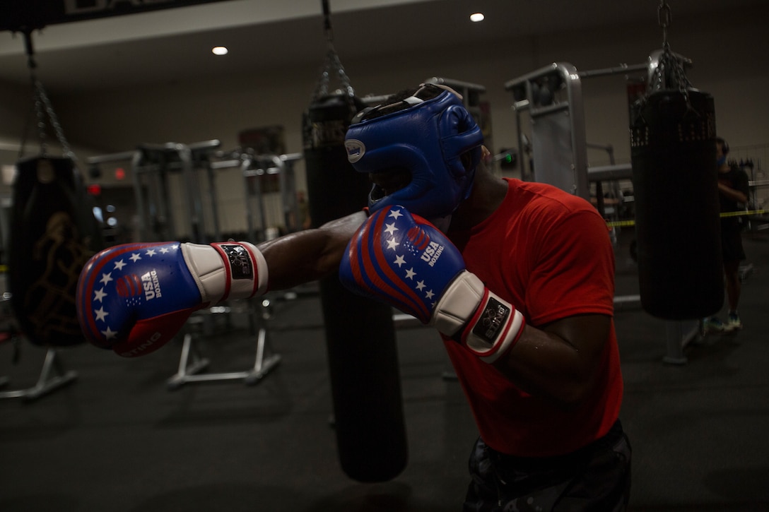 A U.S. Marine Corps boxer with the II Marine Expeditionary Force Martial Arts Center of Excellence boxing program practices fighting techniques on Marine Corps Base Camp Lejeune, N.C., April 20, 2021. The boxing program prepares II MEF Marines to compete in professional level matches through rigorous physical exercise and mental training. As a pilot program, it has already showcased four of its boxers in 2021 at the U.S.A. National Boxing Championship as well as more upcoming matches.
