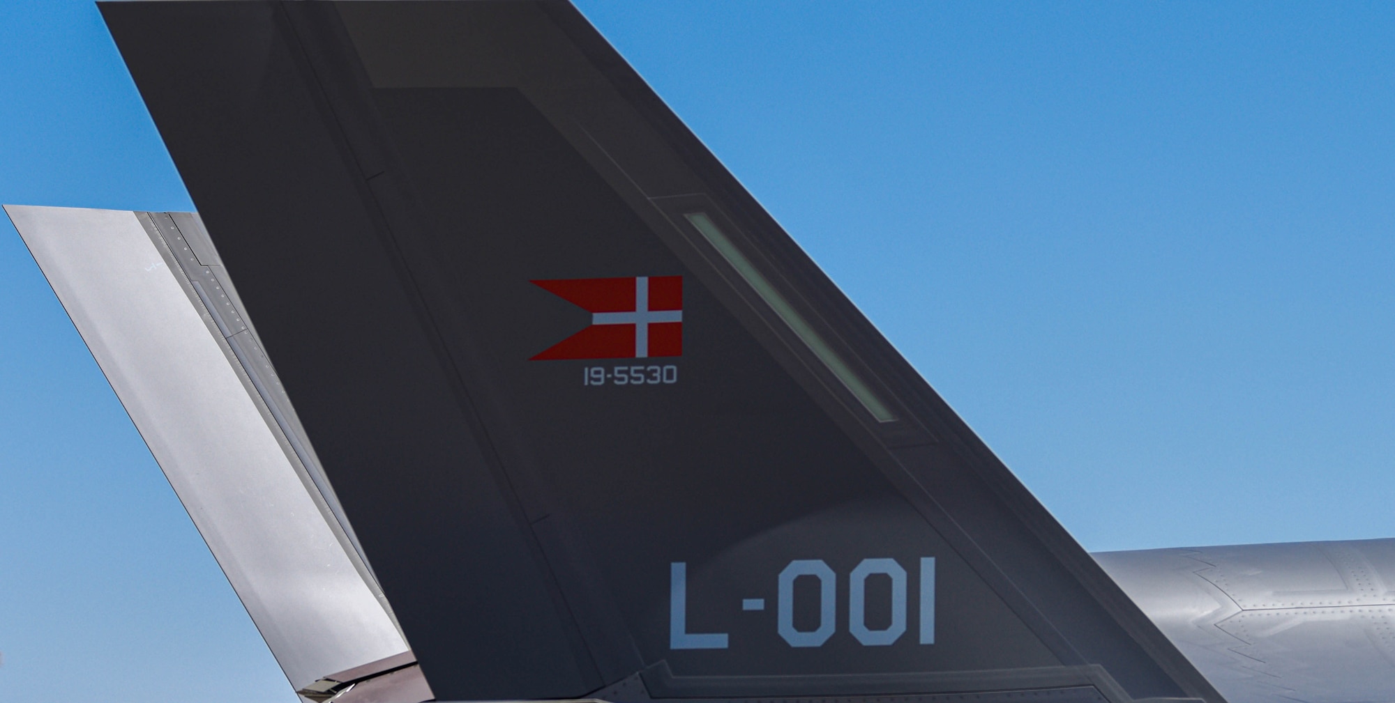 The Danish flag is represented on the tail of a Royal Danish Air Force F-35A Lightning II as the aircraft, assigned to the 308th Fighter Squadron, taxis on a runway April 13, 2021, at Luke Air Force Base, Arizona.