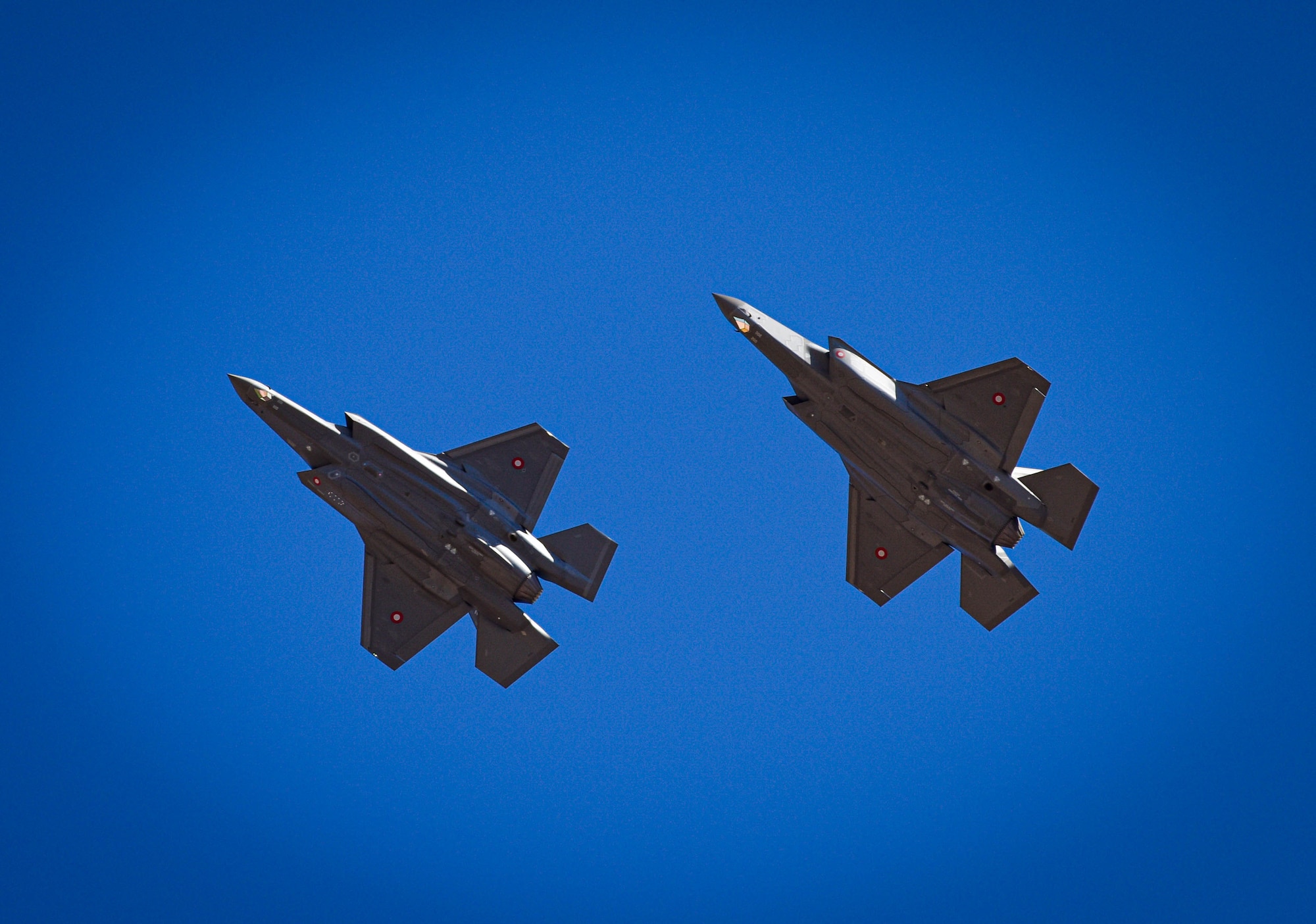 Two Royal Danish Air Force F-35A Lightning II fighter jets assigned to the 308th Fighter Squadron soar, April 13, 2021, over Luke Air Force Base, Arizona.