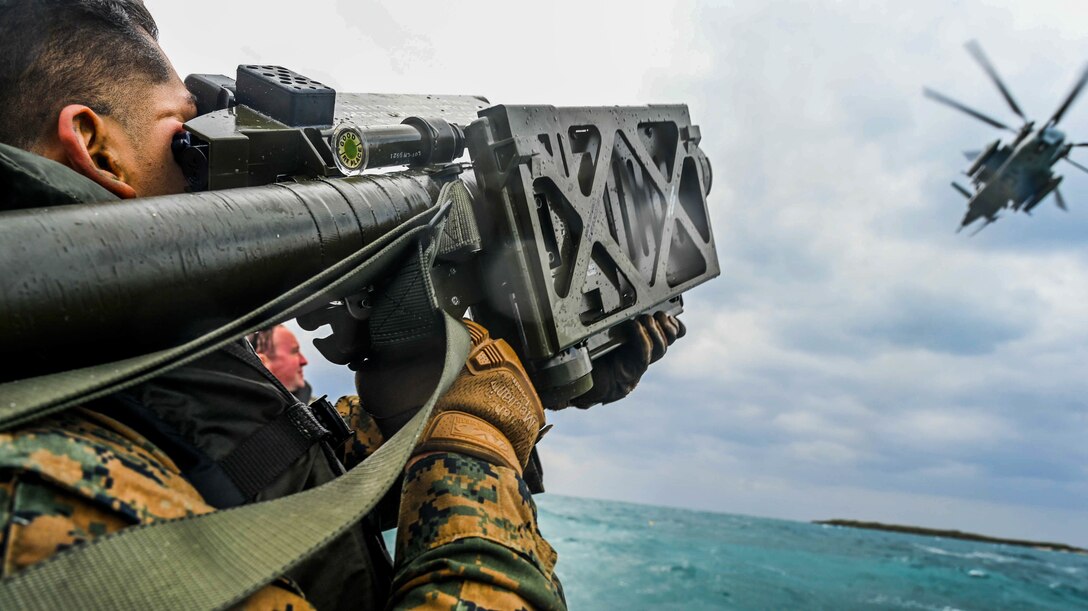 U.S. Marine Corps Lance Cpl. Fernando Castro, a low altitude air defense gunner with 3rd Battalion, 8th Marine Regiment, aims an FIM-92 Stinger missile on a combat rubber raiding craft during exercise Hagåtña Fury 21 on Ukibaru, Japan, Feb. 18, 2021. The exercise demonstrated that Marines are capable of seizing, defending, and providing expeditionary sustainment for key maritime terrain in support of the III Marine Expeditionary Force. 3/8 is attached to 3rd Marine Division as a part of the unit deployment program. Castro is a native of Atlanta, Georgia.