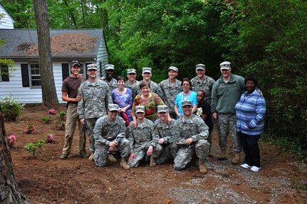 Officer candidates from Class 55 of the Virginia National Guard’s Officer Candidate School clear debris and work on landscape improvements May 4, 2013, as part of their class community project in Richmond, Va. (Photo by Staff Sgt. Terra C. Gatti, Virginia Guard Public Affairs)
