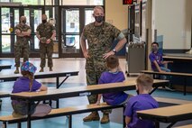 U.S. Marine Corps Col. Curtis V. Ebitz the commanding officer of Marine Corps Air Station New River, speaks with the students of Delalio Elementary School on MCAS New River, North Carolina, April 8, 2021. April is the month of the military child, highlighting the important role military children play in the armed forces community. (U.S. Marine Corps photo by Lance Cpl. Isaiah Gomez)