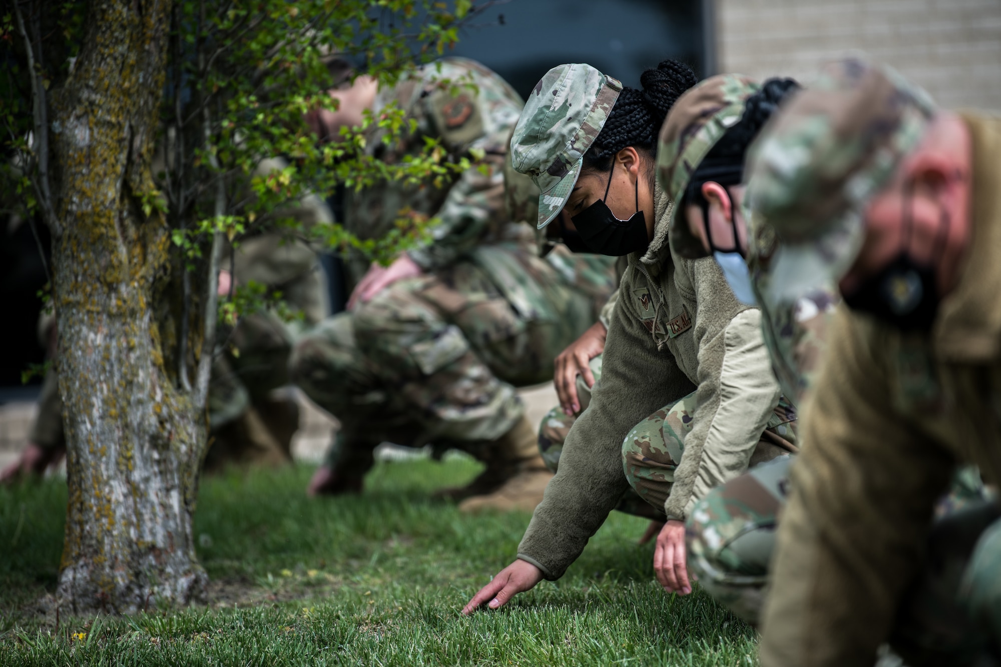 Staff Sgt. Alejandra Joynes, 22nd Force Support Squadron food services journeyman, searches for evidence of simulated remains as part of a search and recovery team during an exercise April 22, 2021, at McConnell Air Force Base, Kansas. The team is responsible for finding all remains and personal belongings in case of fatalities after an accident. (U.S. Air Force photo by Senior Airman Alan Ricker)