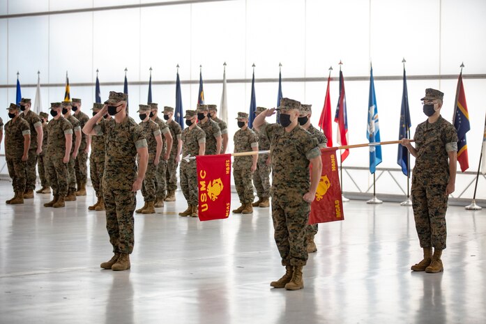 U.S. Marines salute during the playing of the National Anthem at the Marine Corps Air Station New River sergeant major relief and appointment ceremony at the Center for Naval Aviation Technical Training on MCAS New River, North Carolina, April 16, 2021. The relief and appointment ceremony symbolized the passing of responsibilities and duties from Sgt. Maj. Carlos A. Orjuela to the incoming sergeant major, Sgt. Maj. Douglas W. Gerhardt. (U.S. Marine Corps Lance Cpl. Isaiah Gomez)