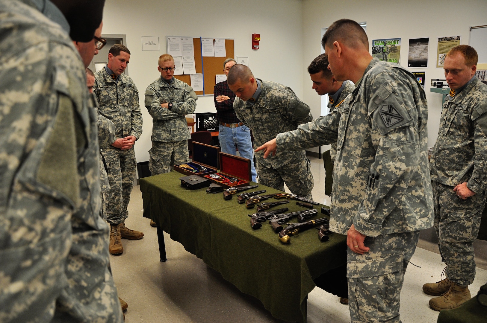 Students of the Virginia National Guard’s Officer Candidate School Class 55 participate in a military history class April 21, 2013 at the Fort Pickett-based 183rd Regiment, Regional Training Institute. The course was taught by Col. Thom Morgan, Virginia Guard director of manpower and personnel, and included more than 75 pieces of primarily Civil War-era military weaponry from the personal collection of Morgan’s father. (Photo by Staff Sgt. Terra C. Gatti, Virginia Guard Public Affairs)