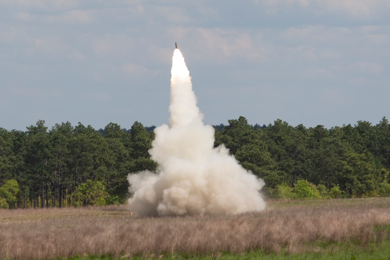 U.S. Marines with 1st Battalion, 10th Marine Regiment, 2d Marine Division (2d MARDIV), fire a High Mobility Artillery Rocket System during Exercise Rolling Thunder 21.2 on Fort Bragg, N.C, April 18, 2021. This is a live-fire artillery exercise where 10th Marines employed distributed fires via simulated Expeditionary Advanced Bases (EAB’s). The training increased 2d MARDIV’s combat readiness against a peer competitor. HIMARS are an advanced long-range and mobile rocket system that allow 2d MARDIV to employ precision fires onto a target. (U.S. Marine Corps photo by Pfc. Sarah Pysher)