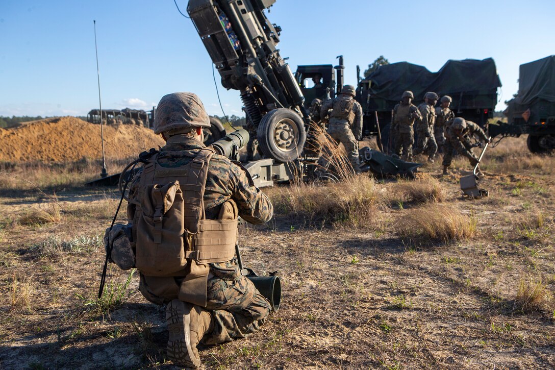 U.S. Marines with 1st Battalion, 10th Marine Regiment, 2d Marine Division (2d MARDIV), position a M777 Howitzer during Exercise Rolling Thunder 21.2 on Fort Bragg, N.C, April 19, 2021. This is a live-fire artillery exercise where 10th Marines employed distributed fires via simulated Expeditionary Advanced Bases (EAB’s). The training increased 2d MARDIV’s combat readiness against a peer competitor. (U.S. Marine Corps photo by Pfc. Sarah Pysher)