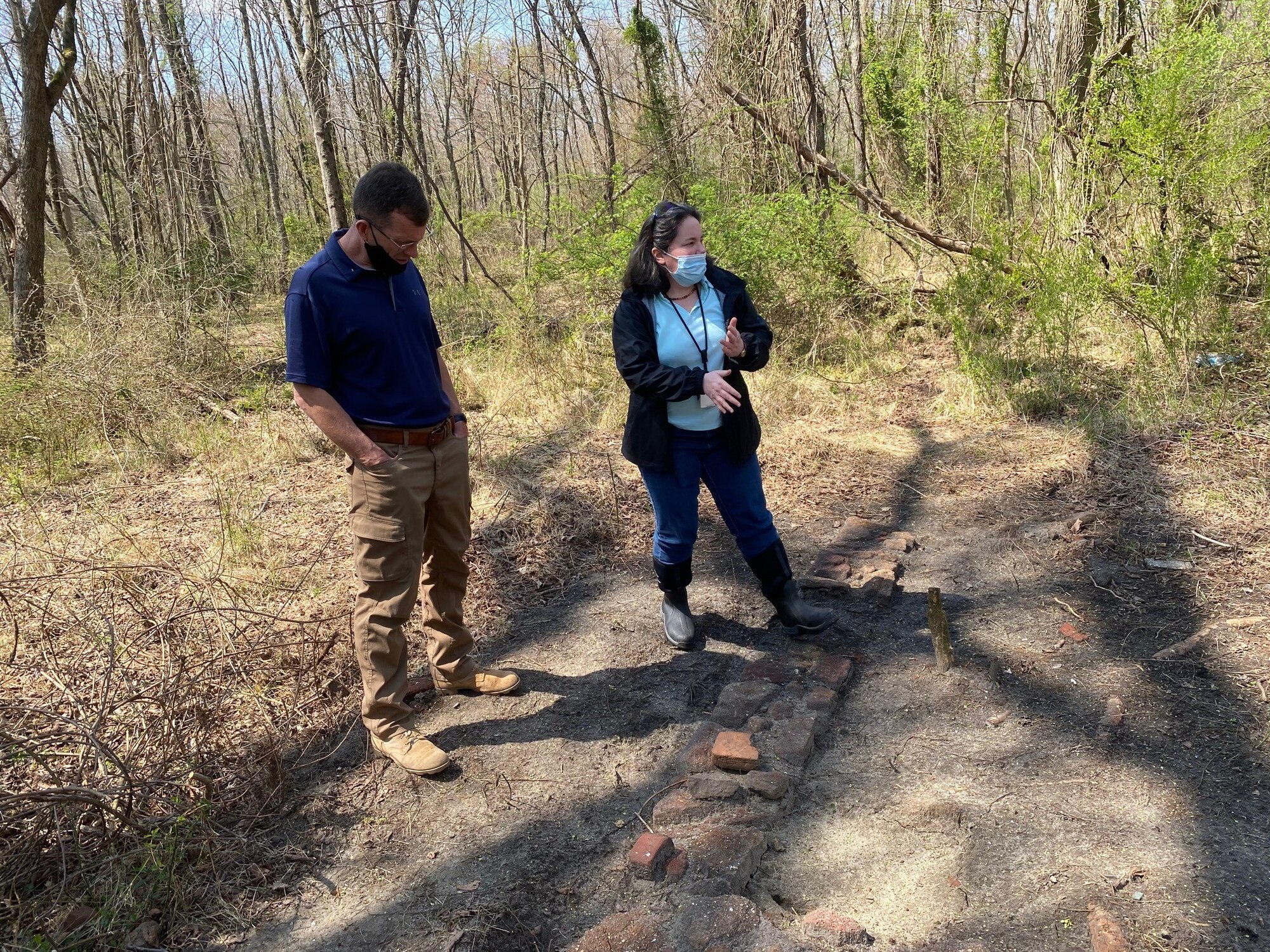 Dr. Sharon White (787 CES/CEIEA) explaining to Historian Stuart Lockhart (305th AMW) the process the archeology teams goes through during an excavation.  7 April 2021