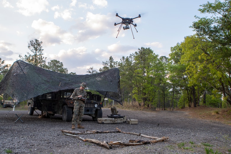 U.S. Marine Corps Lance Cpl. Jacob O’Toole, a native of Morrisonville, Ill., and an intelligence specialist with 1st Battalion, 10th Marine Regiment, 2d Marine Division (2d MARDIV), flies an R-80D SkyRaider drone during Exercise Rolling Thunder 21.2 on Fort Bragg, N.C, April 20, 2021. This is a live-fire artillery exercise where 10th Marines employed distributed fires via simulated Expeditionary Advanced Bases (EAB’s). The training increased 2d MARDIV’s combat readiness against a peer competitor. Small unmanned aerial systems provide increased situational awareness and act as a sensor for expediting decision making. (U.S. Marine Corps photo by Pfc.Sarah Pysher)