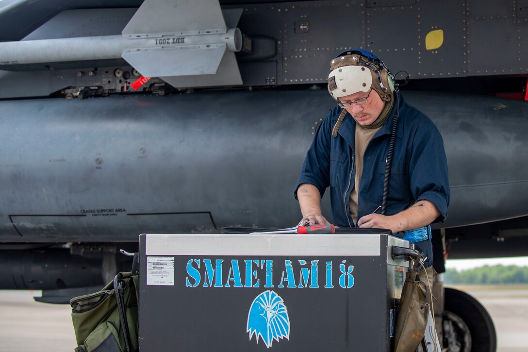 Staff Sgt. Dustin Kennedy, 334th Fighter Squadron crew chief, documents the service he provided to an F-15E Strike Eagle at Seymour Johnson Air Force Base, North Carolina, April 21, 2021.