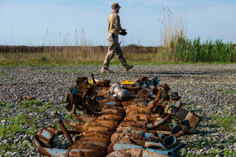 Airman 1st Class Joseph Plato, 4th Civil Engineer Squadron explosive ordinance disposal technician, gathers bomb dummy units (BDU) to prepare for a controlled explosion at Dare County Bomb Range, North Carolina, April 19, 2021.