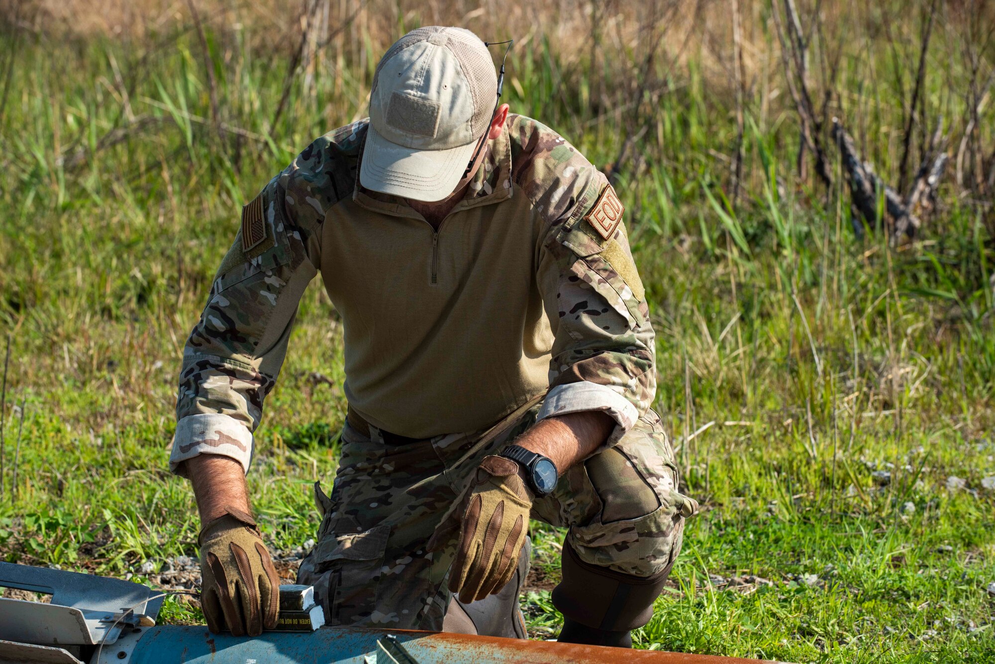 Staff Sgt. Ryan Carel, 4th Civil Engineer Squadron explosive ordinance disposal technician, lays down C-4 explosives for a controlled detonation at Dare County Bomb Range, North Carolina, April 19, 2021