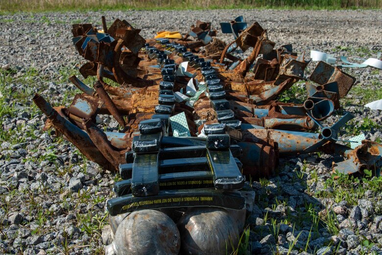 Bomb dummy units (BDU) are covered in C-4 explosives in preparation for a controlled explosion at Dare County Bomb Range, North Carolina, April 19, 2021