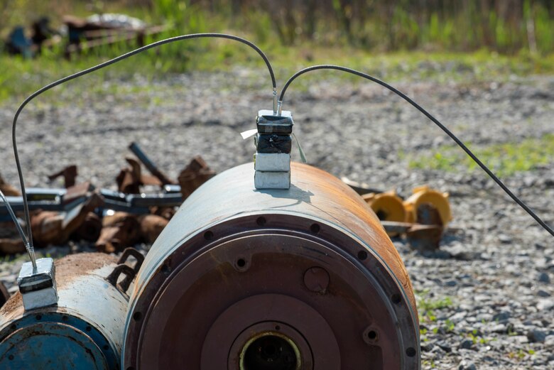 A stack of C-4 explosives sits on top of a bomb dummy unit (BDU) in preparation for a controlled explosion at Dare County Bomb Range, North Carolina, April 19, 2021.