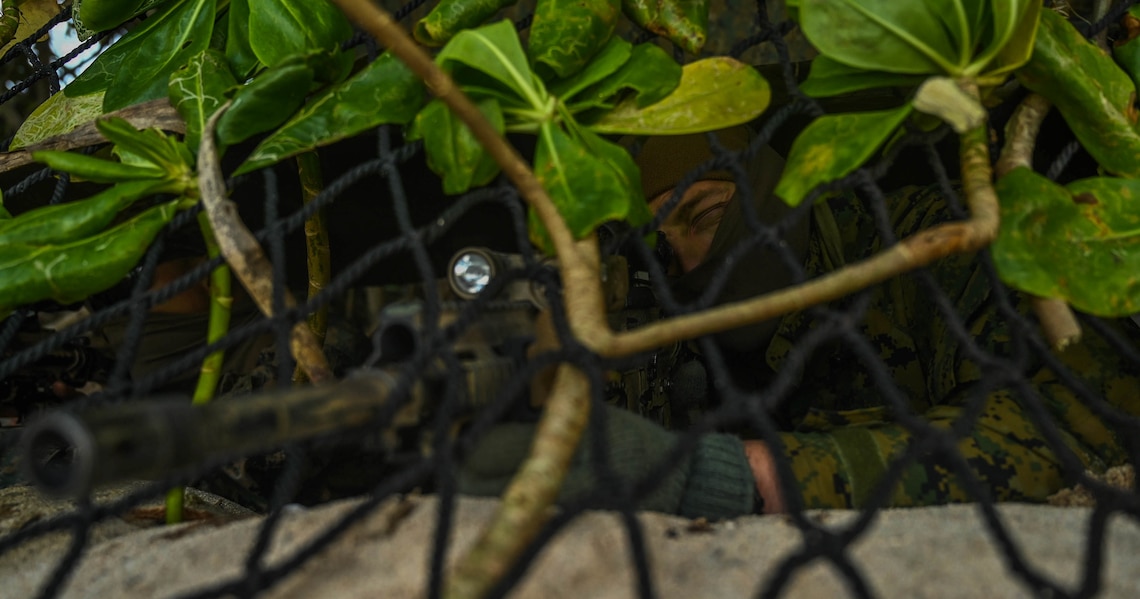 U.S. Marine Corps Lance Cpl. William Martin, a rifleman with 3rd Battalion, 8th Marine Regiment, provides security during exercise Hagåtña Fury 21 on Ukibaru, Japan, Feb. 17, 2021. The exercise demonstrated that Marines are capable of seizing, defending, and providing expeditionary sustainment for key maritime terrain in support of the III Marine Expeditionary Force. 3/8 is attached to 3rd Marine Division as a part of the unit deployment program.