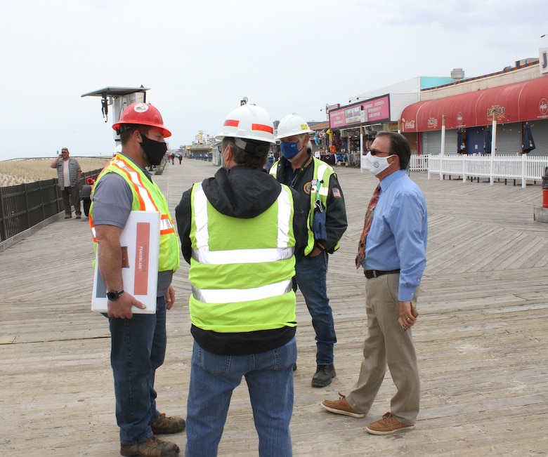 Team members discuss the removable flood barrier on the boardwalk in Seaside Heights, NJ