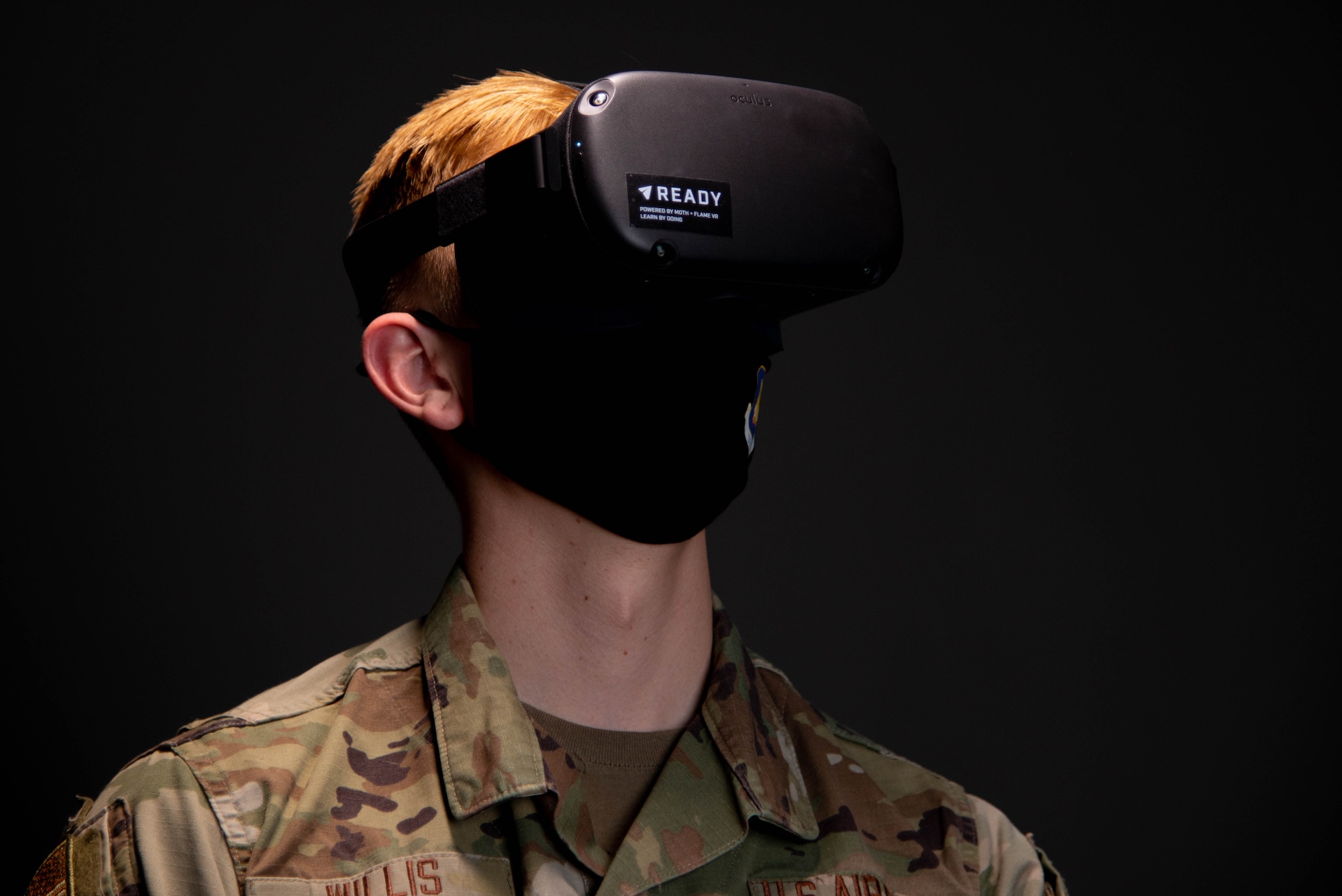 Airman 1st Class Zachary Willis, 22nd Wing Staff Agencies public affairs, experiences the headset used for virtual reality suicide prevention training April 15, 2021, at McConnell Air Force Base, Kansas. Air Mobility Command is the first in the Department of Defense to utilize VR for suicide prevention training.  (U.S. Air Force photo by Senior Airman Nilsa Garcia)