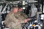 Left to right, US Army Sgt Cody Conklin of the 4th Infantry Division from Fort Carson, Colorado, and Sgt Carl Higgins of the Intelligence, Information, Cyber, Electronic Warfare and Space (I2CEWS), formation from Joint Base Lewis-McCord, Washington, detect and mitigate adversarial radio signals during Cyber Blitz 19 on September 14, 2019.