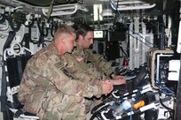 Left to right, US Army Sgt Cody Conklin of the 4th Infantry Division from Fort Carson, Colorado, and Sgt Carl Higgins of the Intelligence, Information, Cyber, Electronic Warfare and Space (I2CEWS), formation from Joint Base Lewis-McCord, Washington, detect and mitigate adversarial radio signals during Cyber Blitz 19 on September 14, 2019.