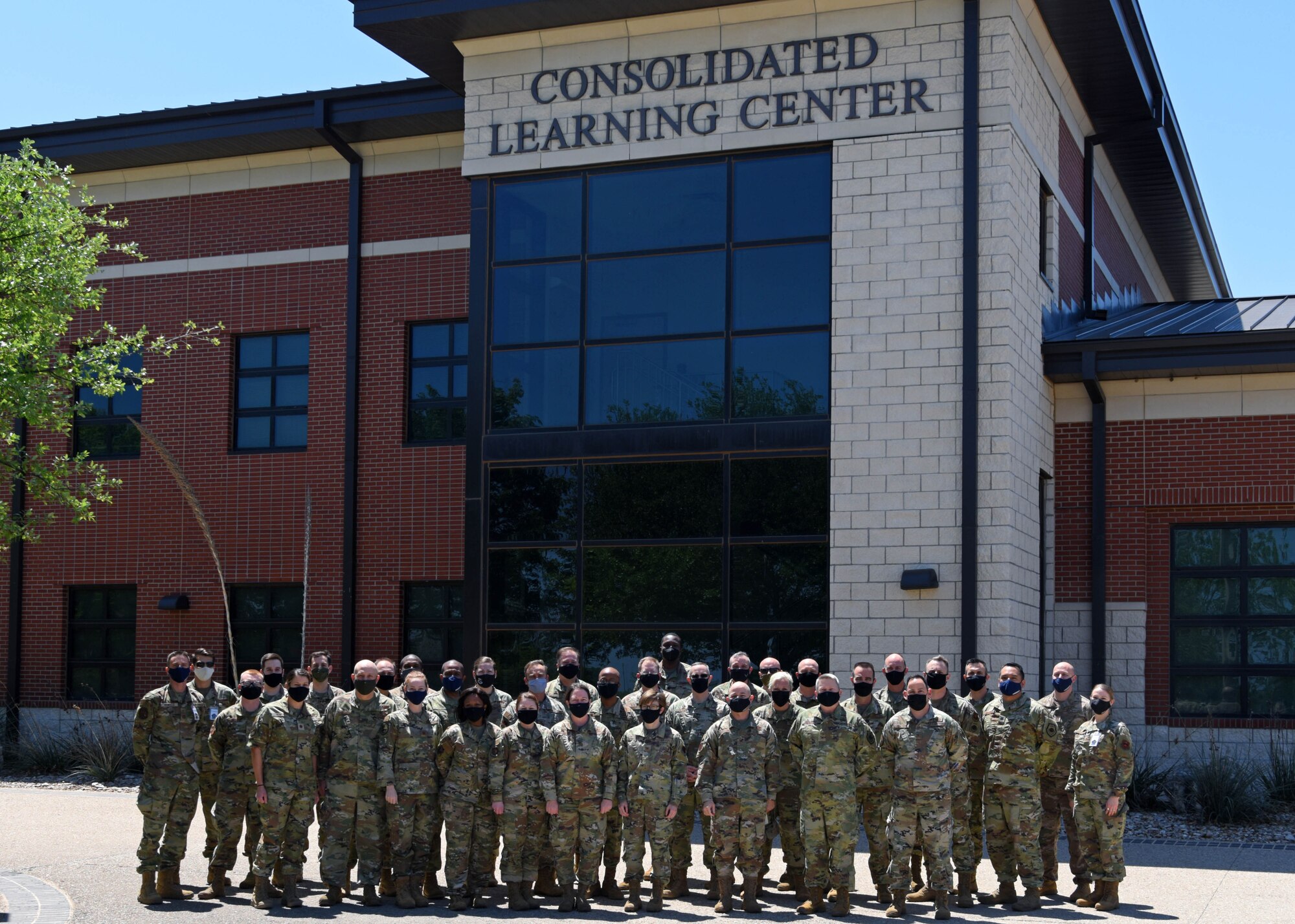 The Intelligence Functional Advisory Team pose with Goodfellow Air Force Base leadership in a photo at the Consolidated Learning Center on Goodfellow Air Force Base, Texas, April 23, 2021. The Intelligence FAC is a team who reviews the framework for the intelligence career field. (U.S. Air Force photo by Senior Airman Ethan Sherwood)